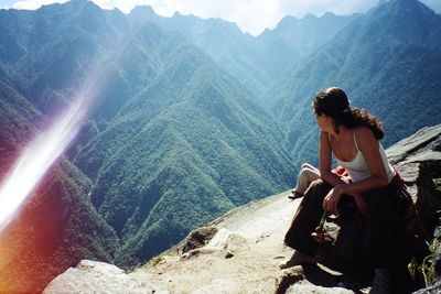 People relaxing on mountain