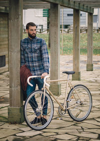 Portrait of man sitting on bicycle