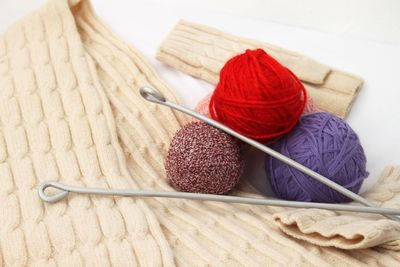 High angle view of multi colored wool balls on table at home