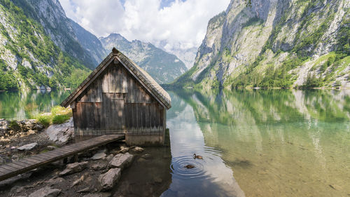 Scenic view of lake and mountains against sky