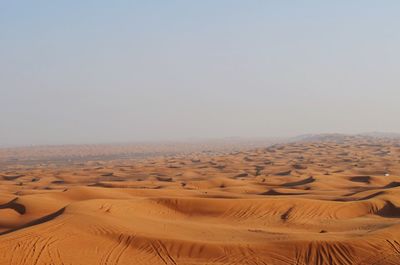 Scenic view of desert against clear sky