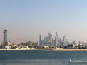 Modern buildings in city against clear sky