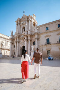 People in front of building