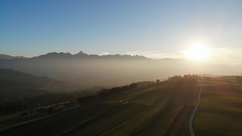 Scenic view of landscape against sky during sunset
