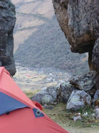 Low section of person standing on cliff