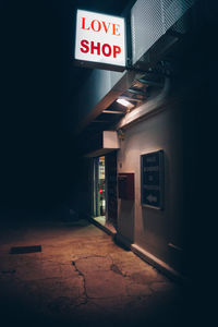 Information sign on wall at night