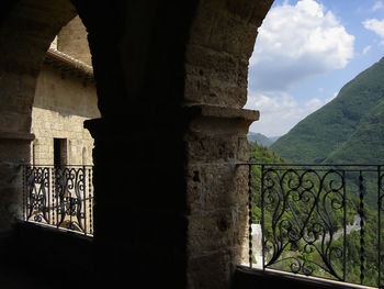 Archway of historic building against sky