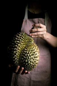 Close-up of hand holding fruit