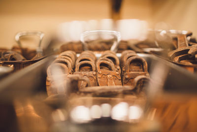 Close-up of rusty metallic padlocks in tray