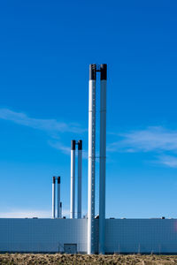 Tall chimneys blue sky and white clouds