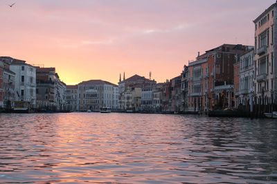 River and buildings at sunset