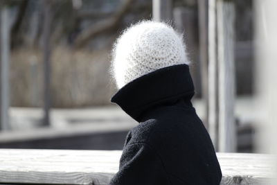 Rear view of young woman wearing hat