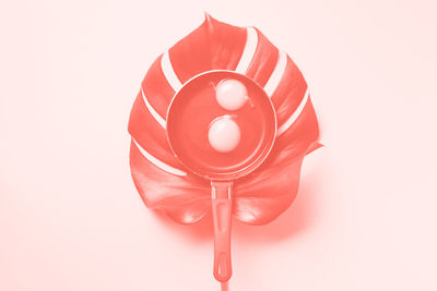 Close-up of red toy against white background