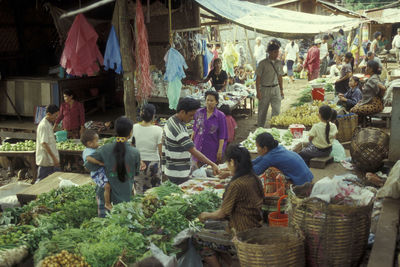 Group of people at market stall