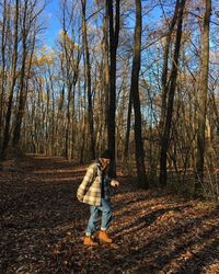 Full length of man walking in forest