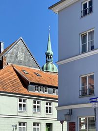 Low angle view of building against blue sky