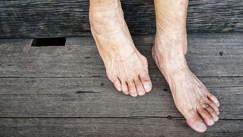 Low section of man on wood