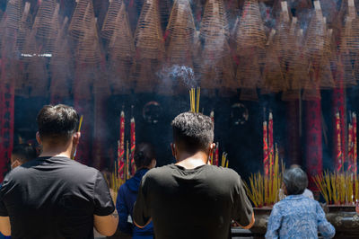 Rear view of people at temple