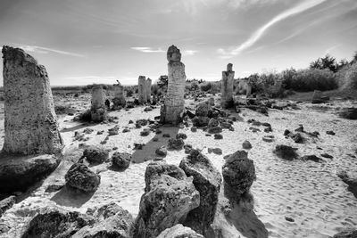 Old ruins on landscape against sky