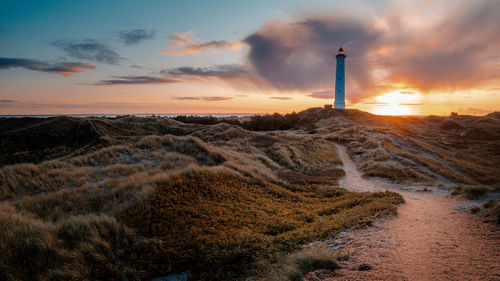Scenic view of beach against sky during sunset
