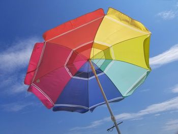 Low angle view of umbrella against sky