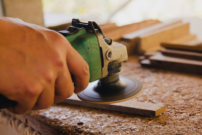 Cropped hand of man working in workshop