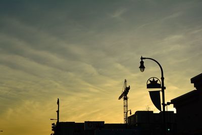 Low angle view of building against sky at sunset