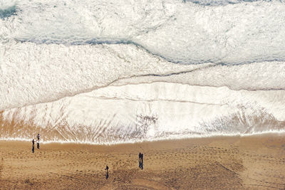 High angle view of people by mountains during winter