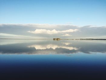 Reflection of clouds in calm sea