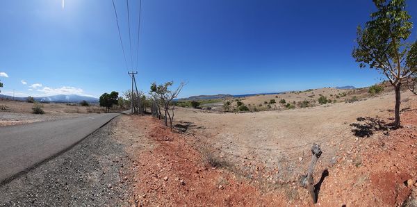 View of road against clear blue sky