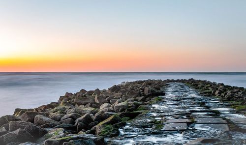 Scenic view of sea at sunset