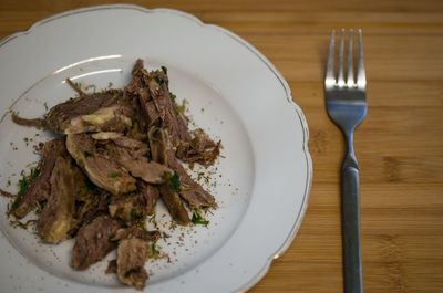 High angle view of meat in plate on table