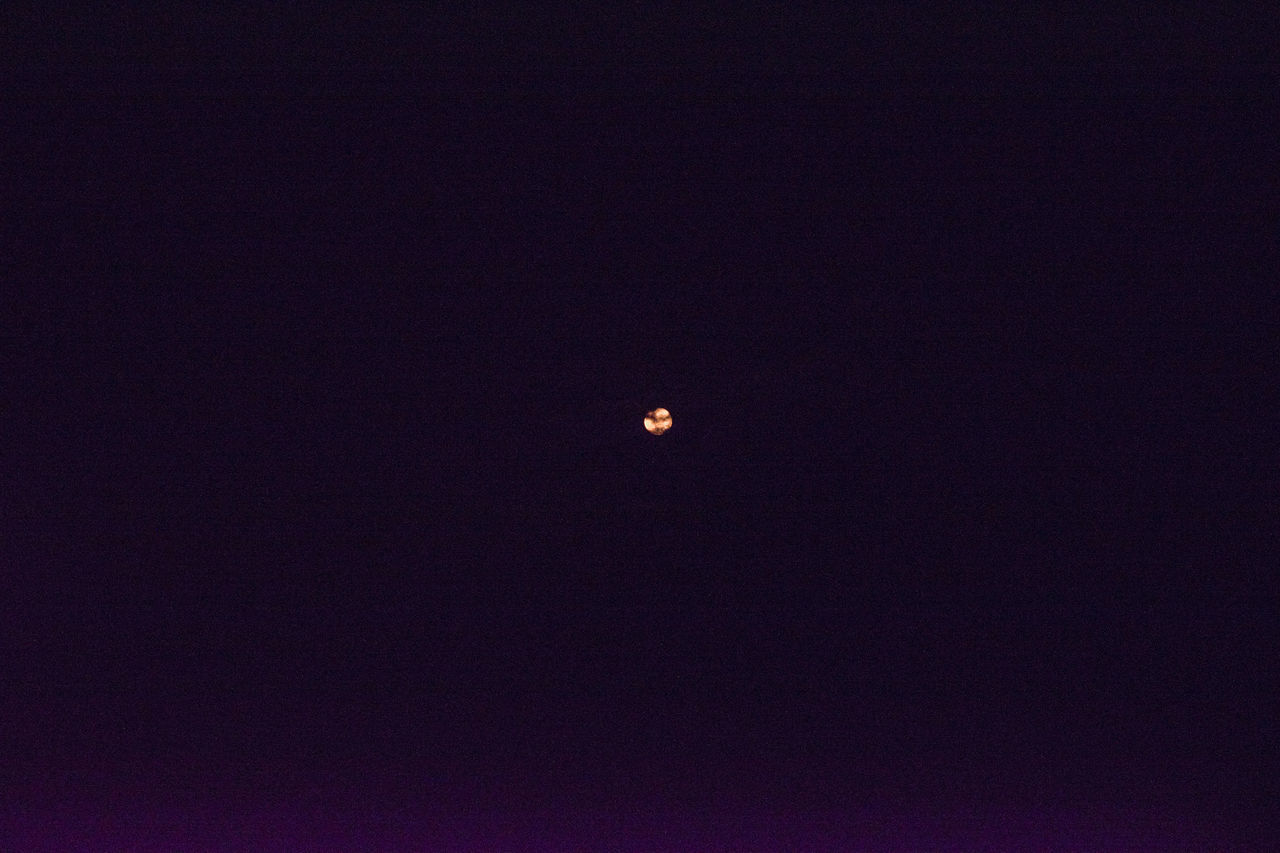 LOW ANGLE VIEW OF MOON AGAINST CLEAR SKY