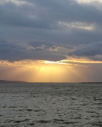 Scenic view of sea at sunset