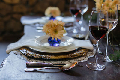 Place setting with wine glasses on table