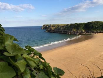 View of calm beach against sky