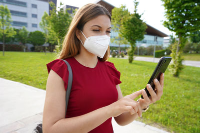 Young woman using mobile phone