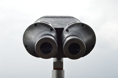 Close-up of coin-operated binoculars against clear sky