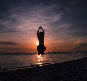 Scenic view of beach at sunset