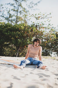 Young man sitting outdoors