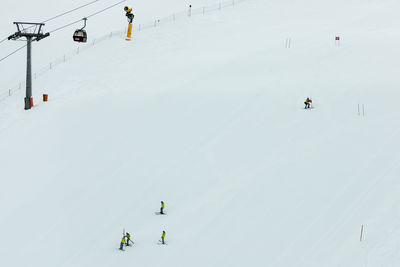 High angle view of people skiing in snow