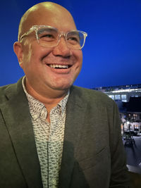 Portrait of smiling man wearing mask outdoors