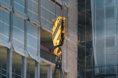 Crane against buildings at construction site