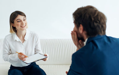 Female doctor examining patient in office