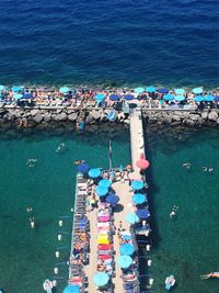 High angle view of people on pier over sea