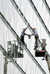 Low angle view of window washer