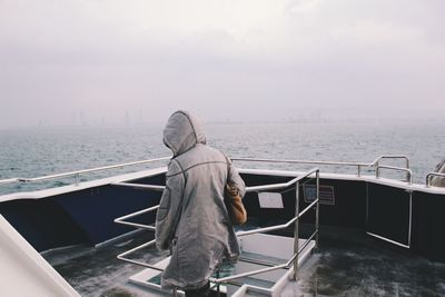 Rear view of person on ship