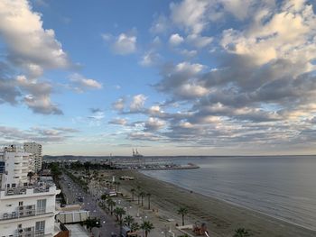 High angle view of beach and buildings against sky