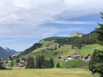 Scenic view of landscape and mountains against sky