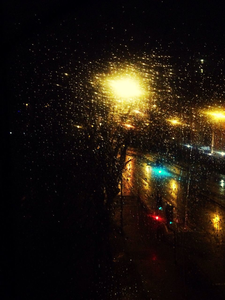 night, illuminated, window, wet, rain, season, car, transparent, glass - material, transportation, drop, weather, land vehicle, indoors, street, street light, raindrop, dark, mode of transport, road